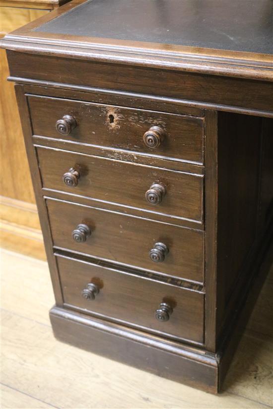 An early 20th century oak pedestal desk, W.143cm